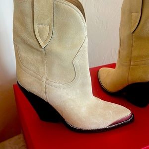 Cream colored suede booties with silver accents